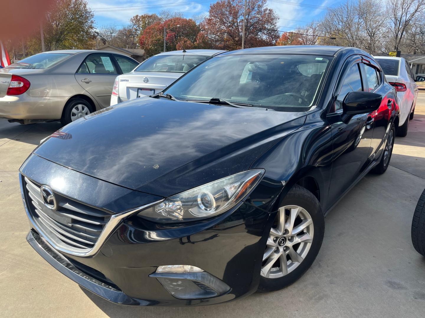 2014 BLACK MAZDA MAZDA3 I TOURING W/S i Touring AT 5-Door (3MZBM1L75EM) with an 2.0L L4 DOHC 16V engine, 6-Speed Automatic transmission, located at 8101 E. Skelly Dr., Tulsa, OK, 74129, (918) 592-3593, 36.121891, -95.888802 - Photo#2